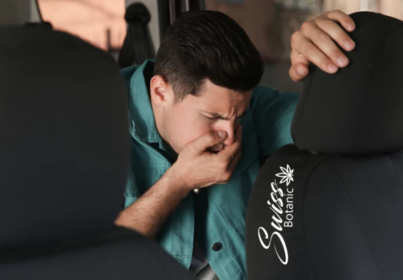 Nausea relief with cbd: understanding its effectiveness 10 A man is sitting in the back seat of a car.