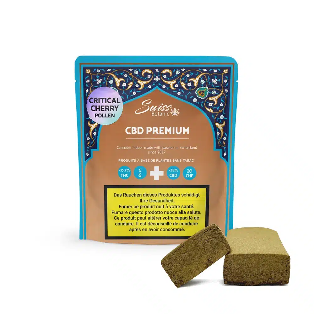 A package labeled "Critical Cherry Pollen CBD Premium - 0.3% THC" displays two pieces of brown compressed cherry pollen in front, with health warnings in several languages visible on the packaging.
